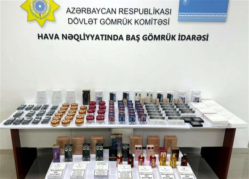 Bahalı əşyaları sərnişinlərə paylayıb aeroportun dayanacağında topladılar - Üstü açıldı