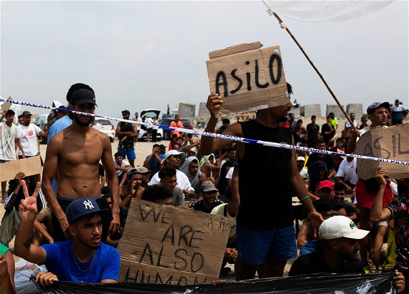 Hundreds of migrants stage protest in Ceuta demanding asylum